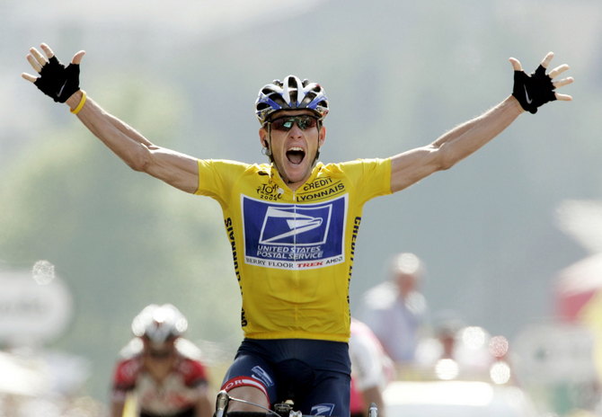 File photo of US Postal rider Lance Armstrong of the United States raising his hands as he crosses the finish line.