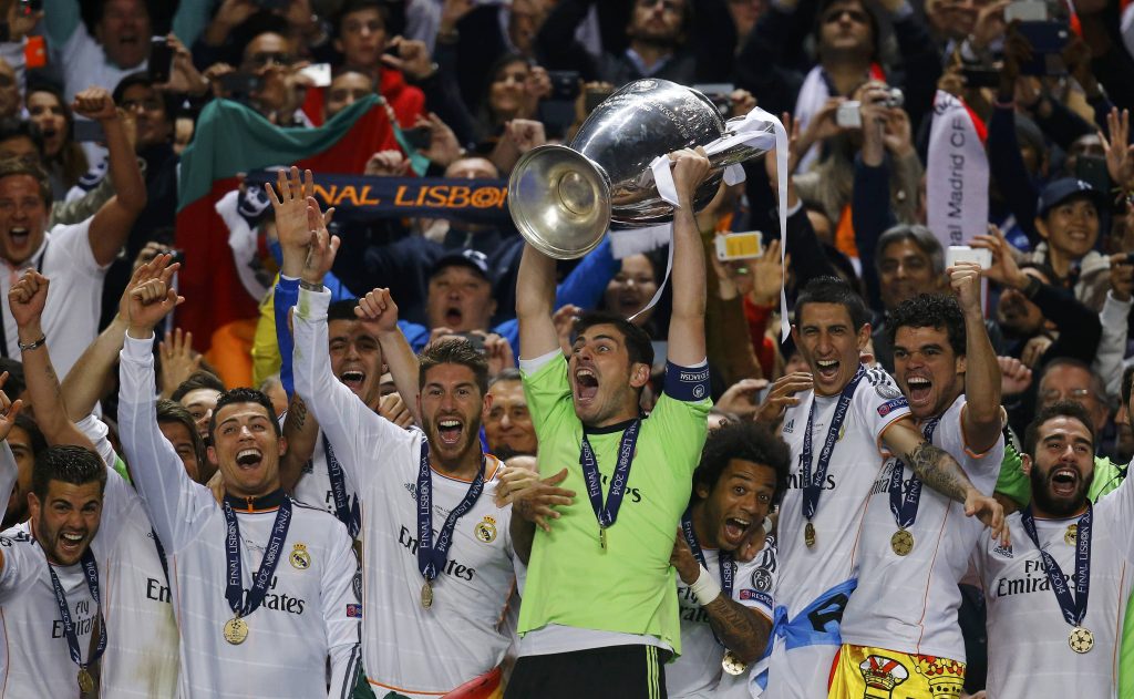 Real Madrid's captain Casillas and team mates celebrate with the trophy after defeating Atletico Madrid in their Champions League final soccer match at the Luz Stadium in Lisbon