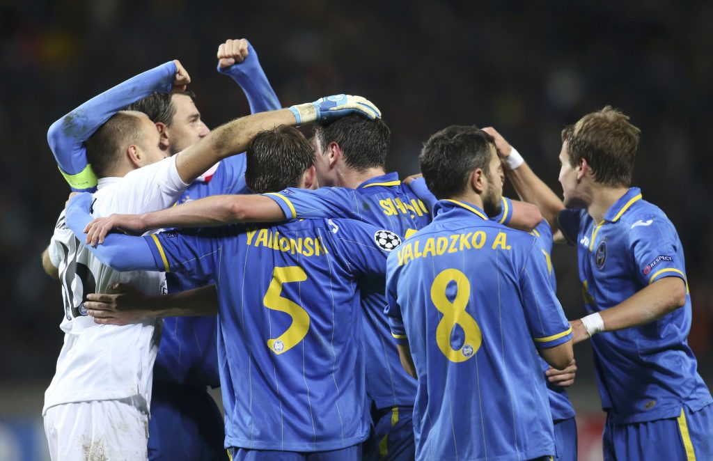 BATE Borisov's players celebrate their victory over Athletic Bilbao in the Champions League soccer match in Borisov